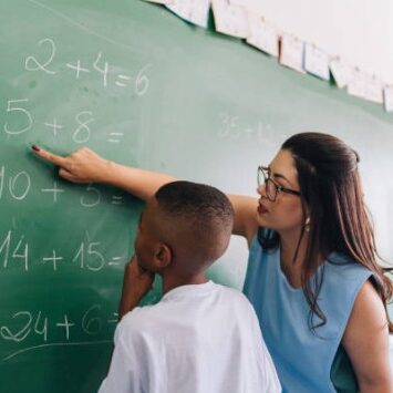 Teacher at blackboard 2